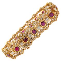 Ruby & Diamond Bracelet Style: Intricate Floral Filigree link Metal: 18K Yellow Gold, 30.31 grams Size & Measurements: 7'' long x 0.65'' (16.3 mm) wide TCW: 10.60 Carats Total Rubies: 15 Round Brilliant Cut, 5.25 Carats Total Origin & Color: Natural Untreated Rubies, Deep Red Color Diamonds: 15 Baguette Cut & 150 Round Brilliant Cut Diamonds Color & Clarity: F - G color, VS2 - SI1 clarity Hallmark: 18K B & B Includes: Certified Appraisal, Elegant Bracelet Box Retail: $18,000 Sku:#114790T#LK11242 Ruby Diamond Bracelet, Noble Lady, Floral Filigree, Expensive Jewelry Luxury, Ruby Bracelet, Bracelet Box, Jewelry Luxury, Bracelet Style, Expensive Jewelry