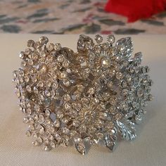 The Bracelet Is A Wide Cuff Bracelet With A Henge. The Width Is 3"S , Height Is 2 And 1/4"S. The Bracelet Is Brand New, Never Used. The Rhinestones Are Complete, Not Missing Rhinestones. No Wear, Excellent Condition. Glamorous Silver Jeweled Crystal Bracelet, Crystal Cuff Bracelet For Weddings, Silver Bedazzled Jewelry As Gift, Silver Bedazzled Jewelry Gift, Silver Bedazzled Jewelry For Gift, Elegant Rhinestone Bangle For Party, Elegant Party Bangle With Rhinestones, Adjustable Silver Bedazzled Jewelry, Adjustable Bedazzled Formal Jewelry