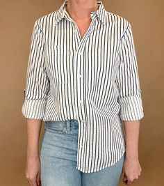 The Marina top is effortlessly beautiful with textured stripes, a split hem &amp; a single chest pocket. Made from 100% cotton, this stylish striped shirt is versatile enough to pair with any casual denim and sandals or work wear. Let it be your go-to piece for effortless fashion. Striped Casual Tops For Business Casual, Striped Tops For Business Casual With Relaxed Fit, Striped Relaxed Fit Top For Business Casual, Relaxed Fit Top With Striped Collar For Business Casual, Casual Striped Tops For Business Casual, Business Casual Striped Top With Relaxed Fit, Striped Relaxed Fit Shirt For Business Casual, Business Casual Vertical Stripes Button-up Tops, Casual Shirt With Contrast Stripes For Work