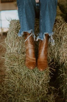 The Caty Western-inspired ankle boot is a legacy style that has transcended over the seasons. With quality craftsmanship and lux materials, these boots only get better with each wear. Details: Suede upper. Manmade outsole. 7 in / 17.78 cm shaft height. 10 in / 25.4 cm topline circumference. 2.5 in/6.35 cm heel. Textile lining. Padded insole. Zipper closure. Leather stacked heel. Fits true to size. Western Ankle Boots Outfit, Black Western Boots Outfit, White Western Boots Outfit, Western Boot Outfit, Western Boots Outfit, Black Western Boots, Boots Outfit Ankle, Leather Cowgirl Boots, Western Ankle Boots