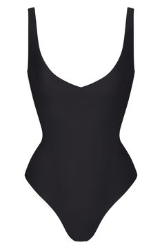 This plunging bodysuit that accentuates your curves is designed to wear along with your favorite bottoms or underneath closet essentials. It features unlined cups to flatter your bust, convertible straps you can wear cross-back style and a snap gusset. V-neck Convertible, adjustable straps Thong back Cotton-lined gusset with snap closure 76% cotton, 24% spandex Machine wash, tumble dry Imported Sleek Seamless V-neck Swimwear, Chic Stretch Shapewear With Lined Body, Chic Bodysuit With Built-in Bra And Low Back, V-neck Lined Bodysuit For Swimming, Summer V-neck Shapewear With Built-in Bra, Elegant Black Seamless Swimwear, Sleek V-neck Seamless Bodysuit, Fitted V-neck Shapewear For Summer, Sleek Seamless Shapewear