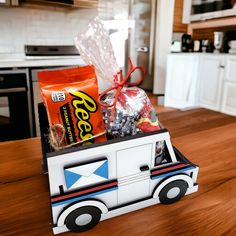 a toy truck with candy and snacks in it