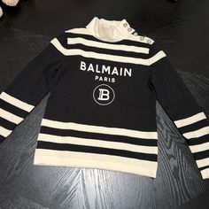 Balmain Paris Panda Sweater New Never Used New Condition Luxury Long Sleeve Winter Tops, Luxury Logo Print Sweater For Fall, Designer Long Sleeve Tops For Winter, Luxury White Long Sleeve Tops, Luxury Logo Print Sweater For Winter, Luxury Winter Sweater With Logo Print, Designer Long Sleeve Winter Tops, Luxury Long Sleeve Sweater With Logo Print, Designer Tops With Logo Print For Winter