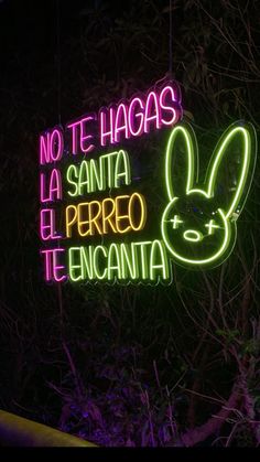 a neon sign that says no te hagas la santa perro tencanta