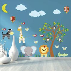 children's wall decals with animals and hot air balloons in the sky above them