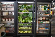 two refrigerators filled with different types of vegetables and fruits in a grocery store or restaurant