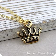 This Royal Crown Charm necklace comes on a gold-plated chain that is available in different lengths. Please choose your desired length from the drop-down menu when placing the item in your shopping cart. { CHARM DETAILS }★ Material: Pewter ★ Finish Color: Gold★ Measurements: 1/2" x 1/2"★ Dimensions: Double-sided★ Made in the USA{ SIMILAR ITEMS } More royal themed items available from my shop: https://www.etsy.com/shop/treasuredcharms/search?search_query=royal{ GIFT OPTIONS}Gift boxes are availab Gold Dangle Charm Necklaces For Birthday, Gold Charm Necklaces For Birthday, Gold Dangle Charm Necklace For Birthday, Gold Spiritual Charm Necklaces For Valentine's Day, Spiritual Gold Charm Necklaces For Valentine's Day, Spiritual Gold Charm Necklaces For Birthday Gift, Gold Spiritual Charm Necklace For Valentine's Day, Spiritual Gold Charm Necklace For Birthday Gift, Gold Jewelry With Lobster Clasp For Birthday