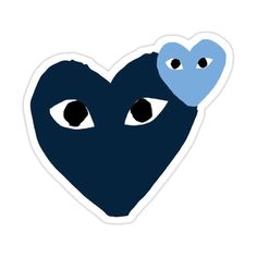 a blue heart with two eyes and a white sticker on it