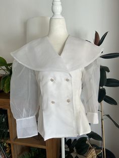 Make a statement in this stunning, white, chiffon, double breasted blouse. Blouse is double lined so that it is less sheer and buttons down the front and at the wrist with jeweled buttons. In overall great vintage condition with no notable flaws, no holes, snags, stains, etc. Label reads Bonnie and Norma, size 10.  Measurements Chest 40in/101.5cm Waist 34in/86.5cm Length 27in/68.5cm Shoulder 16.5in/42cm Sleeve 19.5in/49.5cm *Please keep in mind that unless otherwise noted, all items in my shop a Statement Blouse, White Chiffon, Tucson Az, Vintage Finds, Womens Clothing Tops, Double Breasted, Overalls, Blouses For Women, Chiffon