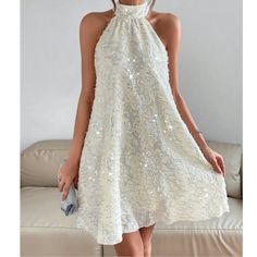 Cream Sequin Halter Mini Dress Xs S M L Xl, 100% Polyester, Ships In 7-8 Days Flowy A-line Sleeveless Party Dress, White A-line Dress For Party Season, White Sleeveless Party Dress For Spring, White Sleeveless Spring Party Dress, White Glamorous Sleeveless Dress For Party, Glamorous White Sleeveless Dress For Party, Glamorous White Sleeveless Party Dress, White Halter Neck Dress For Party Season, White Sleeveless Midi Dress For Party Season