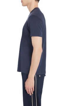 Fluid cotton-enriched jersey brings exceptional drape and a soft hand to this refined take on a wardrobe-staple T-shirt. 27" length (size 38US/48EU) Crewneck Short sleeves 67% lyocell, 33% cotton Dry clean or machine wash, dry flat Made in Portugal Men's Designer Clothing Classic Blue Tops For Loungewear, Classic Navy Crew Neck Top, Classic Navy Top For Everyday Wear, Classic Navy Top For Everyday, Navy Short Sleeve Tops For Loungewear, Blue Jersey Short Sleeve Tops, Casual Navy Jersey Top, Blue Short Sleeve Jersey Top, Navy Crew Neck Jersey Top