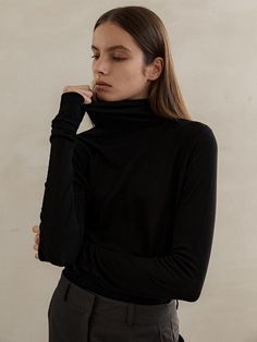 Composition : tencel70% wool30%Color : blackCountry of Origin : Republic of Korea Black Turtleneck For Fall Layering, Black Turtleneck For Workwear In Fall, Black Turtleneck For Fall Workwear, Black Turtleneck For Winter Layering, Black Mock Neck Top For Fall Layering, Black Turtleneck For Layering, Elegant Black Turtleneck For Fall, Fine Knit Turtleneck Tops For Fall, Fall Fine Knit Turtleneck Tops