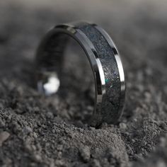 a wedding band that has been made to look like it is in the sand