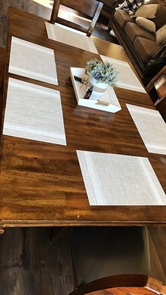 a wooden table with some papers on it