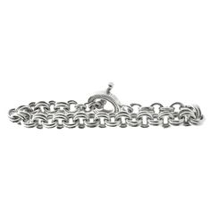 Designer: custom Material: sterling silver Dimensions: bracelet measures 9-inches in length Weight: 77.13 grams Classic Charm Bracelet With Sterling Silver Clasp, Timeless Sterling Silver Jubilee Bracelet With Oval Links, Luxury Sterling Silver Bracelet With Oval Link, Classic Engraved Oval Link Chain Bracelet, Classic Silver Charm Bracelet With Oval Links, Classic Sterling Silver Oval Link Chain Bracelet, Classic Silver Oval Link Charm Bracelet, Classic Silver Charm Bracelet, Classic Sterling Silver Bracelet With Solid Links For Gift