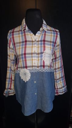 a plaid shirt with white lace on the bottom