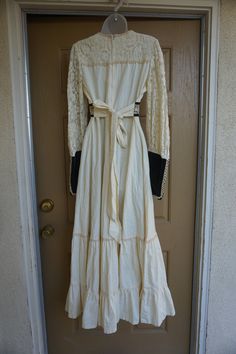 "GUNNE SAX Velvet and cotton green and white prairie dress. Zips in the back and ties at the bust. Adjustable tie at waist. Labeled size 13 - please see measurements. Condition has a few very light spots see last two photos. Measurements taken across front laid flat 19\" across front armpit to armpit 16\" across front of empire waist (ties tighter) 56\" length" Vintage Empire Waist Maxi Dress With Lace Trim, Vintage Long Sleeve Maxi Dress With Lace Trim, Vintage Long Sleeve Lace Prairie Dress, Vintage Fall Festival Maxi Dress, Vintage Maxi Dress For Fall Festival, Vintage Prairie Dress With Lace Trim, Vintage Long Sleeve Prairie Dress For Costume, Vintage Maxi Prairie Dress With Lace Trim, Bohemian Vintage Dress With Lace Trim For Vintage-themed Events