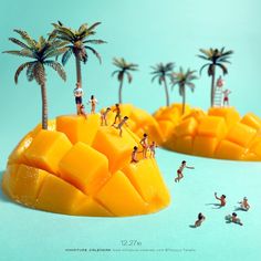 some people are standing on top of mangos in the shape of mountains and palm trees