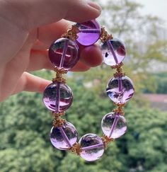 Material:Amethyst Quartz beads size :  18mm quantity: one strand  6mm approx 29 pcs one strands 7mm approx25 pcs one strands 8mm approx 22 pcs one strands 9mm approx 21pcs one strands 10mm approx 19 pcs one strands 11mm approx 18pcs one strands 12mm approx 16 pcs one strands 13mm approx 16 pcs one strands 14mm approx 15 pcs one strands 15mm approx 14pcs one strands 16mm approx 14 pcs one strands 17mm approx 13pcs one strands 18mm approx 13pcs one strands 19mm approx 12pcs one strands 20mm approx 12pcs one strands PLEASE NOTE: 1.Due to lighting effects, monitor's brightness/contrast settings etc, there could be some slight differences in the color tone of the pictures and the actual item. 2.Each piece of natural crystal is unique, the imperfections add natural characters to them. There migh Purple Beaded Bracelet With Large Round Beads, Purple Beaded Bracelets With Large Beads, Purple Round Beads Crystal Bracelet For Healing, Handmade Purple Crystal Bracelet With Round Beads, Handmade Purple Crystal Bracelet, Gold Amethyst Beaded Bracelets, Purple Bracelets With Large Beads, Elegant Crystal Bracelet With Large Beads, Elegant Round Crystal Bracelet With Large Beads