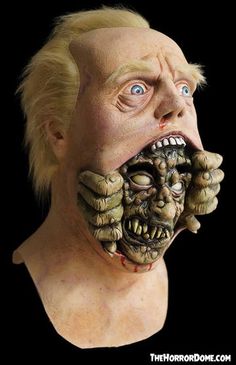 a man wearing a creepy mask with his mouth open