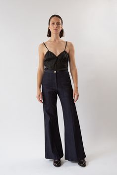 The Darby is our best-selling high-waisted, flared stretch denim pant with front patch pockets and a pintuck stitched down front of each leg. With a subtle 70's svelte silhouette, Darby fits the figure beautifully. Pairs perfectly with slouchy sweaters, fitted blazers, or a simple tee or silk camisole. Erica Tanov This garment is made of a raw denim that has been left in its pure, untreated state. To avoid dye transfer, we recommend an initial separate cold water wash and line dry, which will re Erica Tanov, Stretch Denim Pants, Slouchy Sweater, Silk Camisole, Simple Tees, Silk Slip Dress, Dark Indigo, Fitted Blazer, Raw Denim