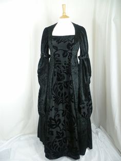 This listing is for a custom made dress,it will be made to the measurements you send me. Please send me your bust,waist and hip measurements,and please measure from the top of your shoulder to the floor with shoes on. It will be made with beautiful jet black crushed velvet and stunning black flocked taffeta....this fabric will also line the inner sleeves.It has a corset style front and back with lacing so you can adjust the dress to fit your body shape. Combined shipping on multiple items. If you purchase express shipping by courier please send me your phone number thank you. Gothic Fitted Gown For Fancy Dress, Elegant Black Gown For Fancy Dress, Fitted Gothic Gown For Fancy Dress, Fitted Black Ball Gown For Costume Party, Fitted Dress With Customizable Length For Banquets, Fitted Ball Gown Corset Dress For Banquet, Fitted Gown With Corset Back For Banquet, Fitted Gown With Corset Back For Banquets, Gothic Evening Dress With Fitted Bodice