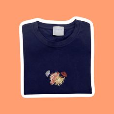 100% cotton t-shirt crafted in Portugal. Flower embroidery as a cute detail in the middle front. Exclusive Juliette pattern Embroidered in New York. Available in 5 different colors; Blue haze - White - Petal pink - Cloudy gray & Navy blue. Navy Blue T Shirt, Embroidery Tshirt, Tshirt Crafts, Flower Embroidery, Embroidery Flowers, Womens Clothing Tops, Cotton Tshirt, Portugal, Bathing Beauties