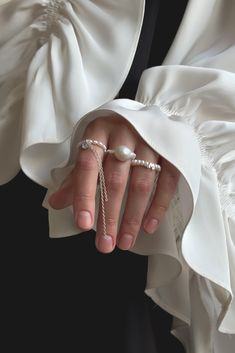 Absolutely exquisite natural pearl ring featuring a delicate baroque pearl set on a beaded elastic band.  Please find more pearl rings from our brand following the link: https://www.etsy.com/shop/ApricusJewelryStore?ref=dashboard-header&section_id=49360875 The elastic design of the ring ensures a comfortable fit, and the durable pearls are resistant to tarnish, making it suitable for wearing to the beach or while swimming. With its unique design and elegant packaging, this ring is the perfect gift for your favorite person. Elegant Pearl Chain Ring, Elegant Pearl Rings With Pearl Chain, Elegant Pearl Ring With Charm As Gift, Elegant Pearl Ring With Pearl Charm As A Gift, Elegant Pearl Ring With Pearl Charm For Gift, Pearl Drop Open Ring, White Pearl Ring With Pearl Chain, Elegant Baroque Pearl Drop Ring, Elegant Pearl Chain Rings For Wedding