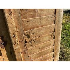 an old wooden door with holes in it