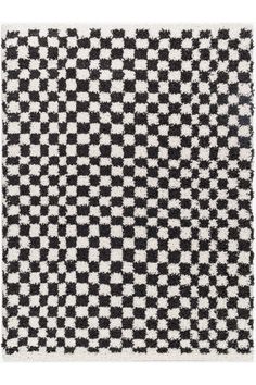 a black and white rug with squares on it