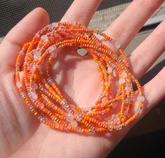 This listing is for a set of ten seed bead boho beaded bracelets. These orange and crystal confetti bracelets have dainty, tiny beads and bugle beads and are strung on strong elastic. They are double knotted and glued shut. These stackable bracelets would be cute friendship bracelets or gifts for best friends, gifts for her. Multi-strand Beaded Bracelets With Spacer Beads As Gift, Adjustable Faceted Beads Jewelry For Summer, Summer Adjustable Jewelry With Faceted Beads, Orange Bohemian Bracelets With Spacer Beads, Adjustable Jewelry With Faceted Beads For Summer, Bohemian Bracelets With Faceted Beads For Summer, Bohemian Faceted Beads Bracelets For Summer, Adjustable Orange Beaded Spiritual Bracelet, Orange Bohemian Beaded Bracelets With Faceted Beads