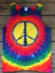 Classic peace sign tie dye shirt. Choose and size, colors, and style!! We offer a variety of colors and designs :) You choose your size and customize your purchase! Also available in youth sizes. We only use the best quality dyes and 100% heavy weight cotton. Allow 5-7 business days for item. FREE SHIPPING! We have a combined experience of 30 years professionally tie dying among our staff. All shirts folded and dyed in the USA. Our items are generally are made to order unless otherwise noted, so Peace Sign Tie Dye, Tie Dye Peace Sign, Shirt Folding, Tie Dye Shirts, Cool Ties, Latest T Shirt, Tie And Dye, Dye Shirt, Tie Dye Shirt