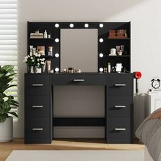 a black vanity with lights on it in a bedroom