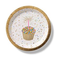 a paper plate with a cupcake decorated with sprinkles