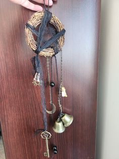 a door with bells and keys attached to it