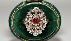 ANTIQUE VICTORIAN 18K GOLD TOP SILVER NATURAL ROSE CUT DIAMOND AND RUBY RING In very good condition. Total weight is 4.8 grams. Totally about 0.08 ct diamond. The diamond has s1-s2 clarity and I-J-K color. Totally 0.30 ct Ruby. Ring size is US 7. We can make any size.(We offer free resizing). Original victorian about 100 years old. Please contact for any questions. Victorian Ruby Ring In Yellow Gold With Intricate Design, Vintage Gold Ruby Ring With Filigree, Victorian Yellow Gold Ruby Ring With Intricate Design, Ornate Yellow Gold Ruby Ring For Anniversary, Ornate Yellow Gold Ruby Anniversary Ring, Victorian Ruby Ring With Diamond, Antique Yellow Gold Ruby Ring With Filigree, Ornate Yellow Gold Hallmarked Ruby Ring, Elegant Ruby Intaglio Ring For Anniversary