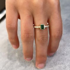 Elevate your jewelry collection with the Emerald Stack Ring, showcasing a stunning array of vibrant emerald stones stacked in a sleek, modern setting for a sophisticated and layered look. Final Sale Stack Ring, Stacked Stone, Emerald Stone, Layered Look, Stackable Rings, Stacking Rings, Rhodium Plated, Final Sale, Jewelry Collection