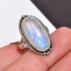 925 Sterling Silver Moonstone Bohemian Handmade Ring, Moonstone Jewelry, Oval Three Bnad Ring, Women Ring, Moon Ring, Rainbow Gift For Her            Moonstone is thought to provide protection to those who travel when the moon is shining . It may enhance intuition and promote inspiration. Moonstone also assists in the acceptance of love. ------------------------------------------------------------------------------------------------------------------------------------ All my Designs are original with 925 Sterling Silver  Size - All Size Ring Stone Name- Rainbow Moonstone Stone Shape- Oval Setting - Bezel Visit For more:-  https://www.etsy.com/in-en/shop/silverindex https://www.etsy.com/in-en/shop/silverindex?ref=seller-platform-mcnav My Spinner Section:- https://etsy.me/3kpiibx My Spinner Bohemian Oval Cabochon Moonstone Ring, Bohemian Sterling Silver Oval Cabochon Moonstone Ring, Adjustable Oval Moonstone Bohemian Ring, Handmade Bohemian Oval Moonstone Ring, Bohemian Silver Moonstone Ring In Oval Cabochon, Bohemian Silver Moonstone Cabochon Ring, Bohemian Silver Oval Cabochon Moonstone Ring, Bohemian Silver Moonstone Ring With Oval Cabochon, Oval Moonstone Crystal Ring Stamped 925