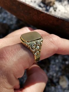 Wonderful vintage mid-century German men's signet ring, blank cartouche and ready to engrave with your initials, symbol, etc., massive 8k gold with two hallmarks (gold & maker's mark). The ring head has a decorative wreath on the side that emphasizes elegance, and a hefty 4.7 g weight. Material: 8k gold, hallmarked Total weight: 4.7 g US Size: approx. 11 (EU size 65) Box on the photos not included. PLEASE LOOK AT THE PICTURES, THEY ARE PART OF THE DESCRIPTION AND ARE THE ACTUAL ITEM YOU WILL REC Antique Gold Signet Ring Collectible, Collectible Yellow Gold Signet Ring With Initials, Gold Engraved Ring With Maker's Mark, Collectible, Classic Collectible Signet Ring With Engraving, Gold Engraved Signet Ring Collectible, Engraved 14k Gold Signet Ring Collectible, 14k Gold Engraved Signet Ring Collectible, Antique 14k Gold Signet Ring Collectible, Collectible Yellow Gold Signet Ring With Engraving Option