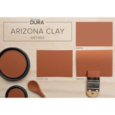 the arizona clay color scheme is shown with two paint brushes, one brown and one orange