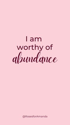 the words i am worthy of abundance are in black and white on a pink background