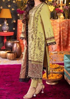 Introducing our New collection 'Asra Festive Collection' by Asim Jofa designed to make you look and feel your best these pieces will add a touch of class and elegance to your wardrobe. Exude refined grace with the golden sequined mehndi outfit from Asim Jofa’s Asra Collection. This outfit is a celebration of heritage featuring a shirt that serves as the backdrop for the exquisite golden zari embroidery and sequin embellishments. The detailed work on the daman and borders exudes a charm that is both ancient and modern. The sleeves with their own embroidered bunches resonate with the theme of opulent design. Draped in the digital zari jacquard dupatta, this ensemble is a symphony of style and grandeur. Embroidered Center Panel On Dyed Lawn. Embroidered Front Left and Right Kali On Dyed Lawn. Burkha Designs, Organza Kurti, Batik Print Dress, Mehndi Outfit, Dupion Silk Saree, Indian Anarkali, Sherwani Groom, Anarkali Lehenga, Lehenga Suit