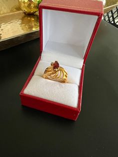 We have a unique unbranded/ not stamped gold tone garnet gem ring. The ring has a small faux diamond on the side. We stumbled upon this ring at an estate sale. The ring is in excellent condition very minor marks. The ring is size US 6 All of our jewelry is secondhand and pre loved, please see attached photos for better description of the piece. If you have any more question please feel free to message us thanks! Gold Ruby Ring For Proposal, Gold Solitaire Ruby Ring For Proposal, Garnet Gem, Gem Ring, Garnet Ring, Garnet Rings, Fort Worth, Rings Statement, Estate Sale