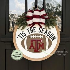 this is an image of a door with a football wreath and the words tis the season on it