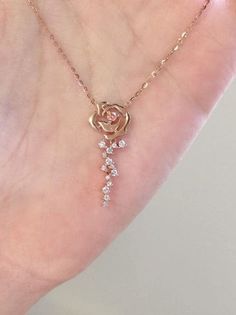 Description:Dainty Rose Necklace Specifications:Material: cubic zirconia, copper, 18k rose goldColors: rose goldSize: 40 cm + 5 cm extWeight: 2 g/pcs "Add a touch of daintiness to any outfit with our charming Dainty Rose Necklace 🌹 Perfect for any occasion, this necklace features a delicate rose pendant that is sure to turn heads. A stylish and versatile accessory that brings elegant flair to any look." Rose Gold Jewelry With Roses For Her, Delicate Rose Gold Cubic Zirconia Necklace, Valentine's Day Rose Gold Jewelry With Roses, Rose Gold Jewelry With Roses For Mother's Day, Valentine's Day Rose Gold Necklaces With Rose Design, Elegant Roses Necklace For Mother's Day, Rose Gold Necklaces With Rose Design For Anniversary, Delicate Rose Gold Necklaces With Roses, Rose Gold Flower Pendant Jewelry For Party