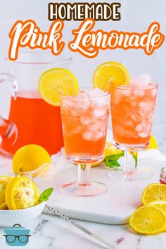 homemade pink lemonade in glasses with ice and lemons