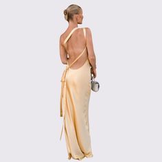 Jessica Gold Silk Maxi Dress - Shop Now - Aunomay Long Backless Satin Dress For Summer, Gold Backless Maxi Dress For Summer, Summer Long Satin Backless Dress, Summer Satin Backless Long Dress, Yellow Bias Cut Dress For Party, Bias Cut Yellow Dress For Party, Yellow Bias Cut Dress For Summer, Yellow Bias Cut Summer Dress, Spring Backless Bias Cut Dress