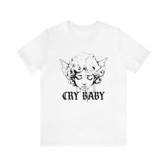 🖤 Let Your Emotions Flow with Our 'Crybaby' Cherub T-Shirt 🖤 Unleash a touch of gothic sentimentality with our 'Crybaby' Cherub T-Shirt. Perfect for those who wear their hearts on their sleeves, this tee features a block print of a crying cherub with dripping paint, paired with the word "crybaby" in an elegant gothic font. A unique blend of classic artistry and goth culture. Why You'll Cherish This Tee: Expressive Cherub Design: A poignant crying cherub with a modern dripping paint effect, emb White Emo T-shirt With Graphic Print, White Emo Style T-shirt With Graphic Print, White Gothic T-shirt For Streetwear, Gothic White T-shirt For Streetwear, Goth Culture, Cherub Design, Dripping Paint, Emotional Expression, Gothic Font