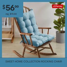 a wooden rocking chair with blue cushions on the back and price tag for $ 59 00