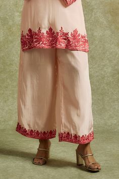 Peach kurta embroidered with kashmiri aari embroidery. Paired with a flared pant with matching embroidered hem. - Aza Fashions Traditional Floral Embroidered Pants For Festive Occasion, Traditional Floral Embroidery Pants For Festive Occasion, Traditional Embroidered Palazzo Set In Mulmul, Traditional Floral Embroidered Festive Pants, Traditional Cotton Pants With Zari Work, Traditional Mulmul Palazzo Set With Floral Embroidery, Traditional Embroidered Festive Pants, Traditional Festive Embroidered Pants, Traditional Wedding Bottoms With Resham Embroidery